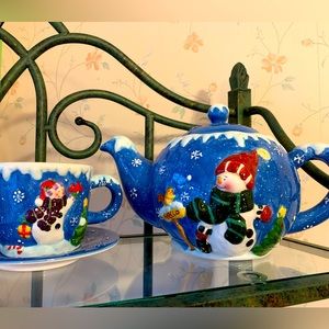 Teapot and matching cup and saucer. Snowman motif.